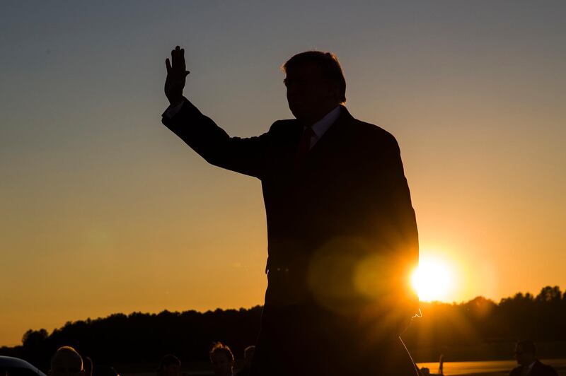 FILE - In this Nov. 26, 2018, file photo, President Donald Trump waves as he arrives to speak during a rally for Sen. Cindy Hyde-Smith, R-Miss., at Tupelo Regional Airport, in Tupelo, Miss. (AP Photo/Alex Brandon, file)