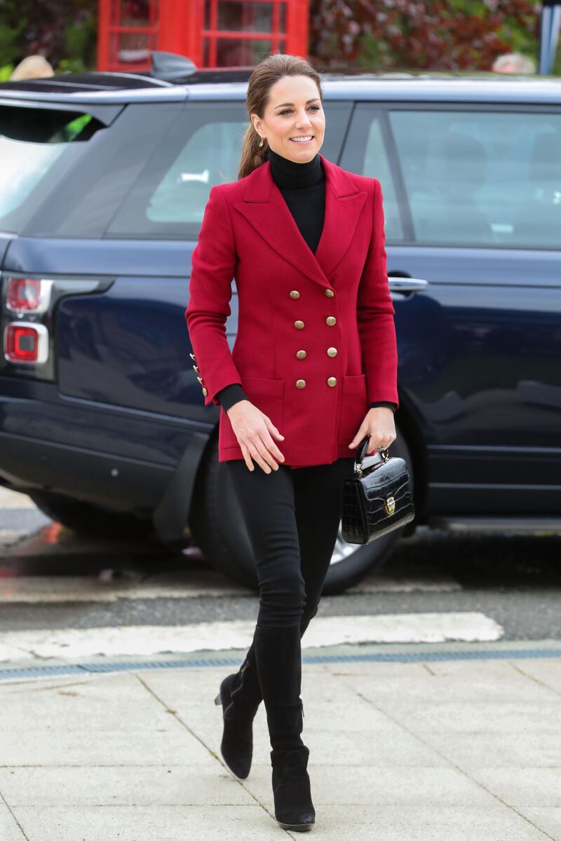 The Duchess of Cambridge wears a Philosophy by Lorenzo Serafini blazer over a black polo neck and black jeans, Aquatalia Rhumba platform boots and an Aspinal Midi Mayfair bag with Kiki McDonough visiting Halen Mon Anglesey Sea Salt in North Wales on May 8. Getty Images