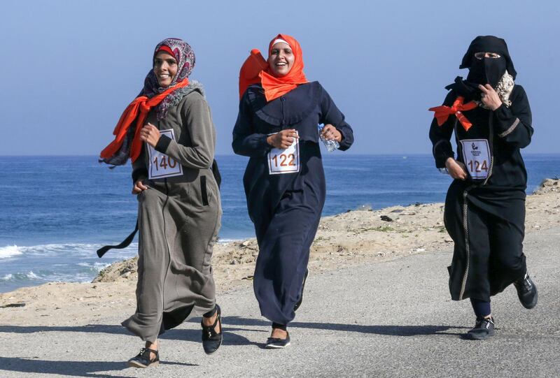 Palestinian women take part in a marathon calling for an end to violence against women, in Khan Yunis in the southern Gaza Strip. AFP