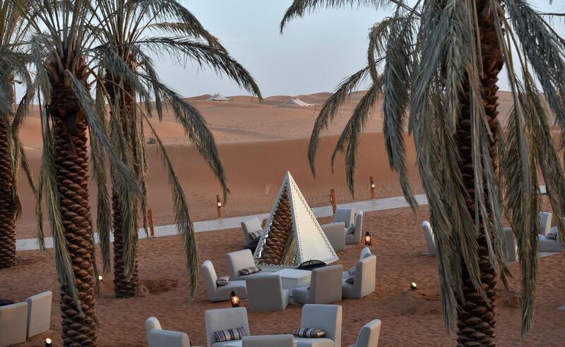 A lounge area amid rolling dunes at the "Riyadh Oasis." AFP