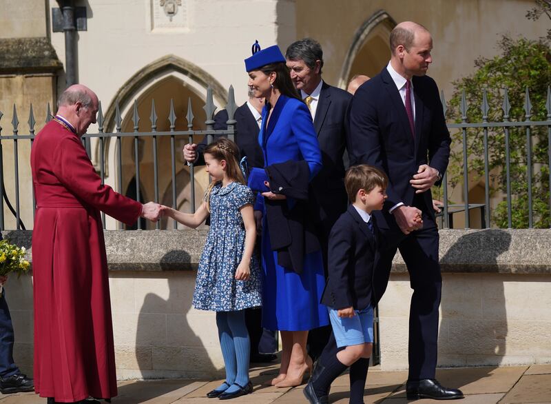 Prince William an d his wife Kate with Princess Charlotte and Prince Louis after the Easter Mattins Service. PA