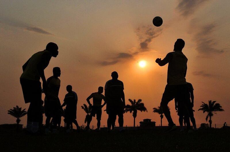 Cameroon players take part in a training session at sunset in Gabon ahead of the Africa Cup of Nations final against Egypt. Samuel Shivambu / EPA