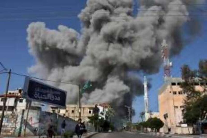 Smoke rises from an explosion at the Hamas central security headquarters and prison, known as the Saraya, after it was hit in an Israeli missile strike in in Gaza City, Sunday, Dec. 28, 2008.  More than 270 Palestinians, have been killed and more than 600 people wounded since Israel's campaign to quash rocket barrages from Gaza began midday Saturday.(AP Photo/Adel Hana) *** Local Caption ***  JRL131_MIDEAST_ISRAEL_PALESTINIANS_GAZA.jpg