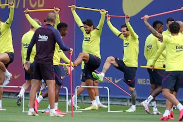 This handout pictured made available by FC Barcelona shows (fromL) Barcelona's Uruguayan forward Luis Suarez and Barcelona's Argentine forward Lionel Messi attending a training session at the Ciutat Esportiva Joan Gamper in Sant Joan Despi on June 8, 2020. Lionel Messi trained again with his teammates to give Barcelona a massive boost ahead of their La Liga return against Mallorca next June 13, 2020. Messi has been suffering from tightness in his right thigh and had not trained fully since last week. - RESTRICTED TO EDITORIAL USE - MANDATORY CREDIT "AFP PHOTO / HANDOUT / FC BARCELONA / MIGUEL RUIZ" - NO MARKETING - NO ADVERTISING CAMPAIGNS - DISTRIBUTED AS A SERVICE TO CLIENTS / AFP / FC BARCELONA / Miguel RUIZ / RESTRICTED TO EDITORIAL USE - MANDATORY CREDIT "AFP PHOTO / HANDOUT / FC BARCELONA / MIGUEL RUIZ" - NO MARKETING - NO ADVERTISING CAMPAIGNS - DISTRIBUTED AS A SERVICE TO CLIENTS