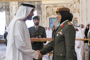 Sheikh Mohamed bin Zayed, Crown Prince of Abu Dhabi and Deputy Supreme Commander of the UAE Armed Forces, bestows the Second Class Medal of Honour to Col Dr Aisha Al Dhaheri during a ceremony at Qasr Al Bahr Majlis in Abu Dhabi on Monday. Courtesy Sheikh Mohamed bin Zayed / Twitter