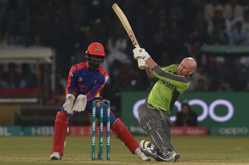 Lahore Qalandars's Ben Dunk (R) hits a shot aagainst Karachi Kings. AFP