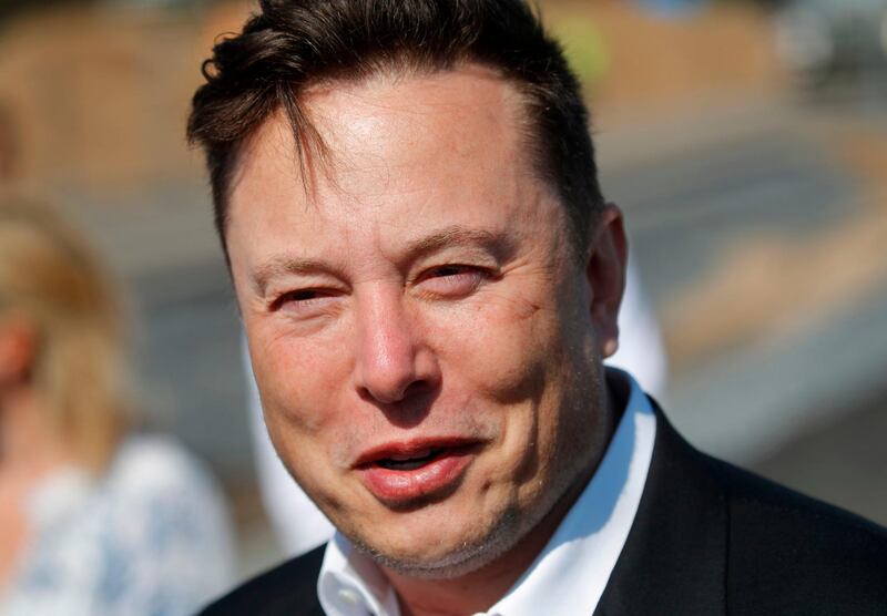 Tesla CEO Elon Musk talks to media as he arrives to visit the construction site of the future US electric car giant Tesla, on September 03, 2020 in Gruenheide near Berlin. Tesla builds a compound at the site in Gruenheide in Brandenburg for its first European "Gigafactory" near Berlin. / AFP / Odd ANDERSEN
