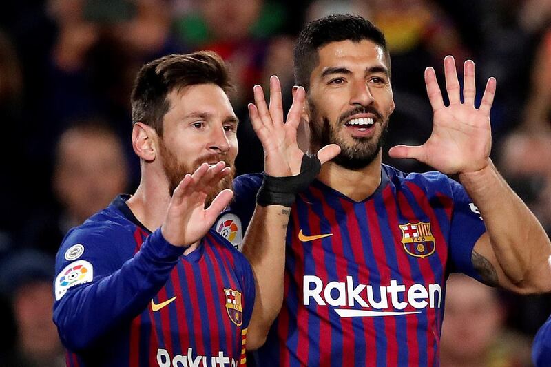 Lionel Messi, left, and Luis Suarez, celebrate. EPA