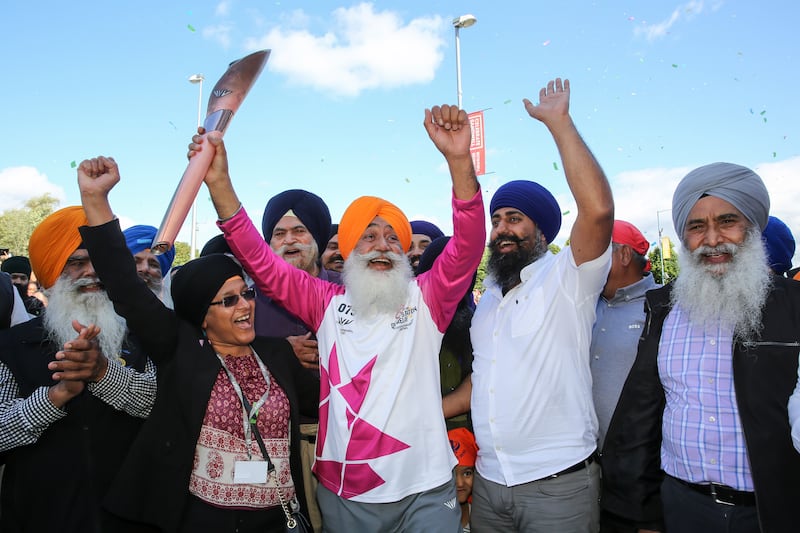 Parmjit Singh raises the baton in Smethwick, England. Getty Images