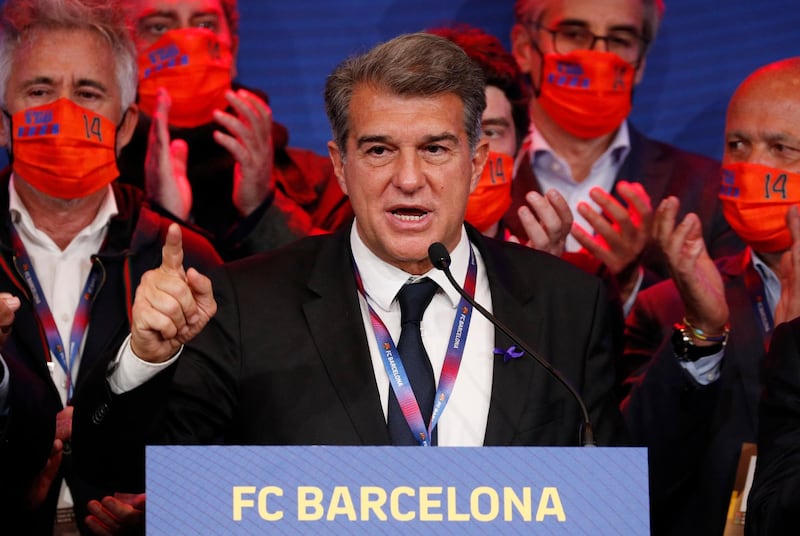 Joan Laporta and his staff during press conference. Reuters