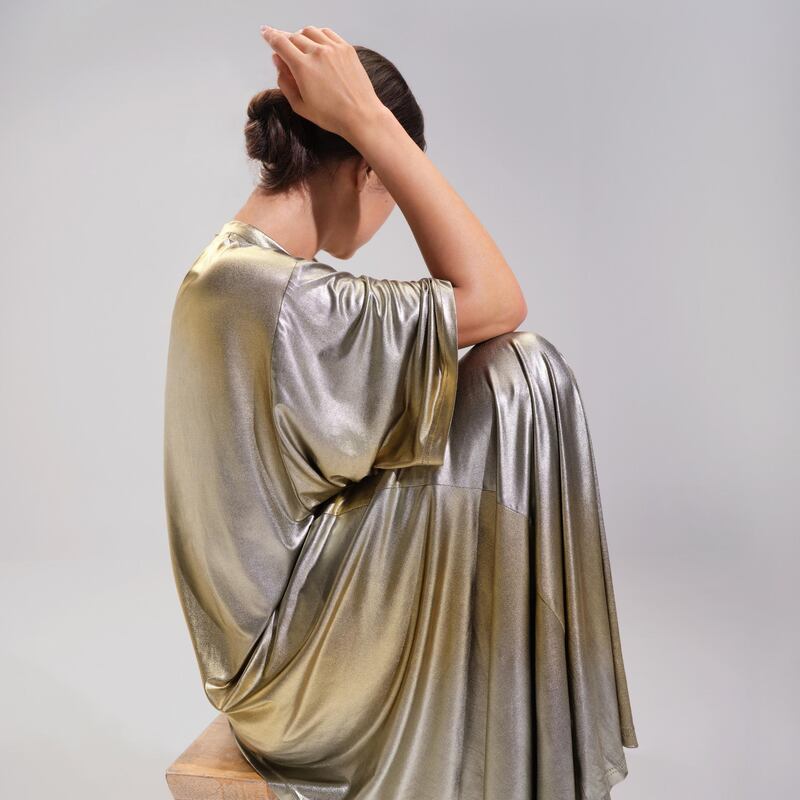 Jessica K's molten silver dress is being auctioned as part of the Autism Spectrum Fashion Collection auction.