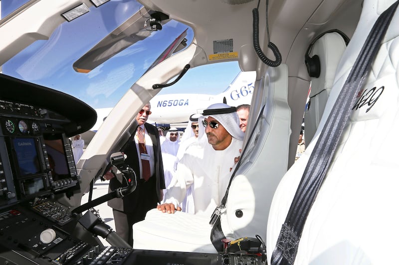 
DUBAI , UNITED ARAB EMIRATES – Dec 8 , 2014 : Sheikh Ahmed Bin Saeed Al Maktoum , President of the Department of Civil Aviation , CEO and Chairman of The Emirates Group and Chairman of Dubai World looking the Bell helicopter during his visit at the Middle East Business Aviation air show held at Dubai World Central in Dubai. ( Pawan Singh / The National ) For Business. Story by Shereen Elgazzar *** Local Caption *** bz28de-DPS-pictures2014-05.jpg
