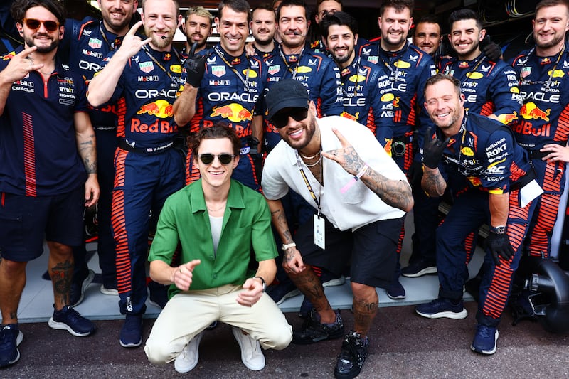 Tom Holland and Neymar pose for a photo with the Red Bull team ahead of the Monaco GP on Sunday. Getty