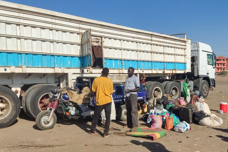 Displaced people fleeing Wad Madani in Sudan's Al Gezira state arrive in Gedaref on Sunday. AFP