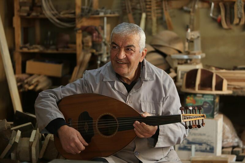 Lebanese oud maker and player Nazih Ghadban plays an oud in his workshop. As an oud player, he is the first person to hear a finished instrument. Reuters