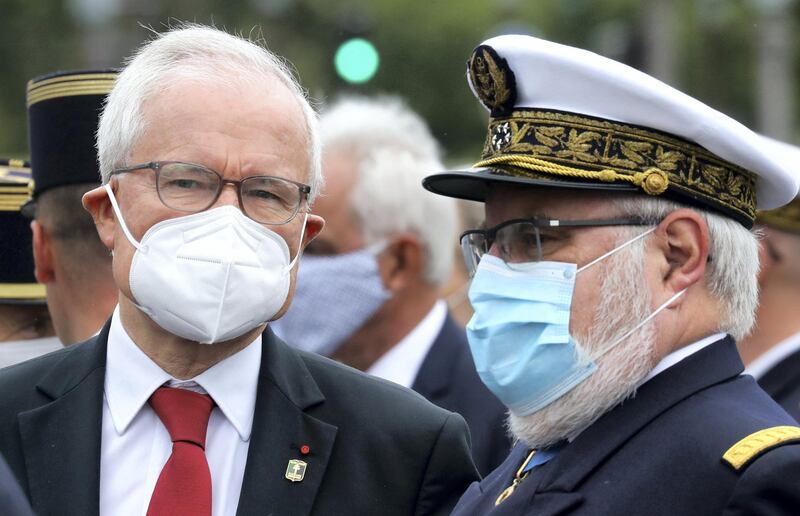 Director of the French external intelligence agency General Directorate of External Security (DGSE) Bernard Emie (L) and President's personal Chief of Military Staff Admiral Bernard Rogel (R) react at the end of the annual Bastille Day military ceremony on the Place de la Concorde in Paris, on July 14, 2020. - France holds a reduced version of its traditional Bastille Day parade this year due to safety measures over the COVID-19 (novel coronavirus) pandemic, and with the country's national day celebrations including a homage to health workers and others fighting the outbreak. (Photo by Ludovic Marin / POOL / AFP)