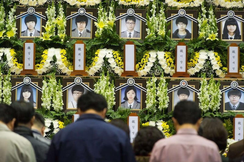 People attend a memorial for the victims of the  South Korean ferry disaster.  Kim Do-hoo / AFP Photo April 24

