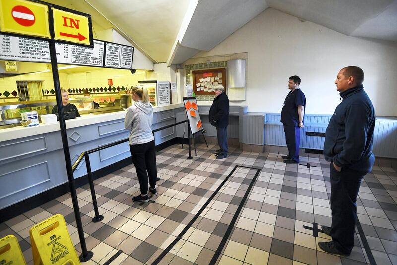 BRADFORD, ENGLAND - MAY 01: A general view of social distancing being observed whilst a customer is served at Gullivers Fish and Chip shop on May 01, 2020 in Bradford, England. British Prime Minister Boris Johnson, who returned to Downing Street this week after recovering from Covid-19, said the country needed to continue its lockdown measures to avoid a second spike in infections. (Photo by George Wood/Getty Images)