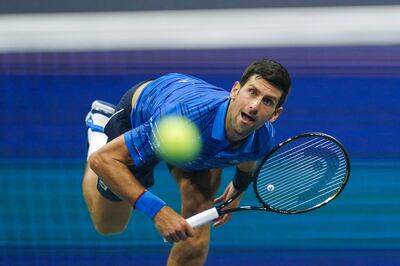 TOPSHOT - Novak Djokovic of Serbia serves against Stan Wawrinka of Switzerland in their Round Four Men's Singles tennis match during the 2019 US Open at the USTA Billie Jean King National Tennis Center in New York on September 1, 2019.  / AFP / DOMINICK REUTER
