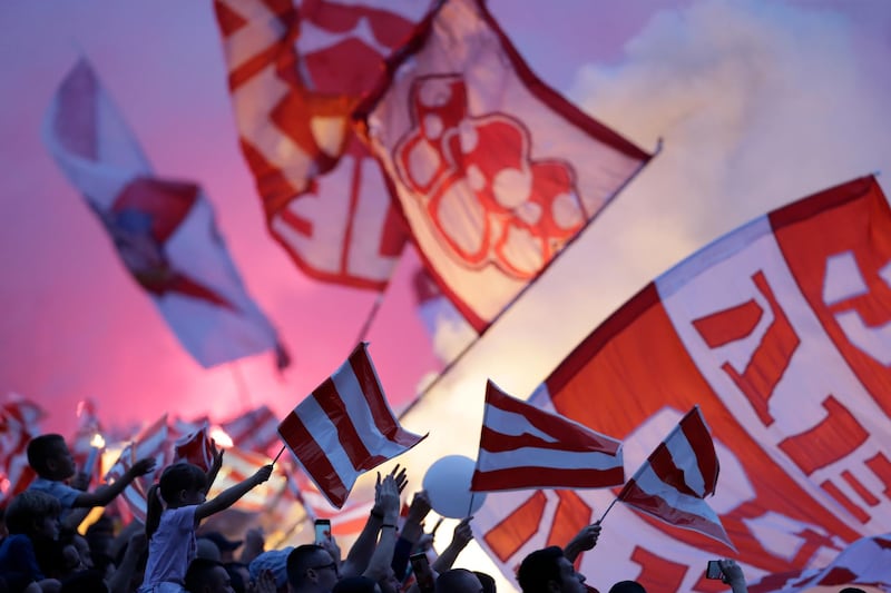 Supporters of Red Star wave flags during the SuperLiga title celebration in Belgrade, Serbia. EPA