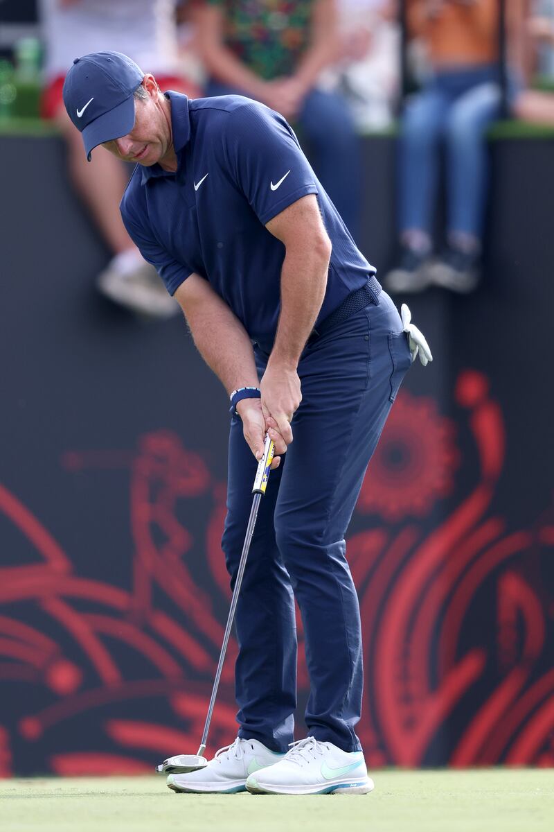 McIlroy putts on the 15th green. Getty