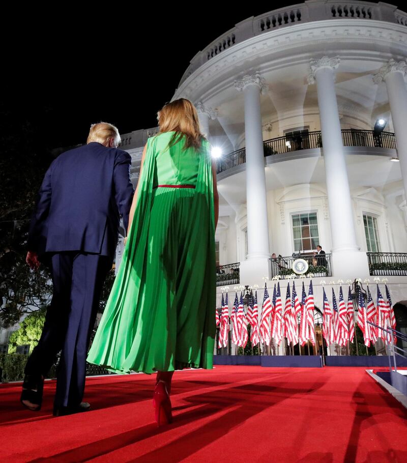 U.S. President Donald Trump walks back into the White House with first lady Melania Trump after delivering his acceptance speech. Reuters
