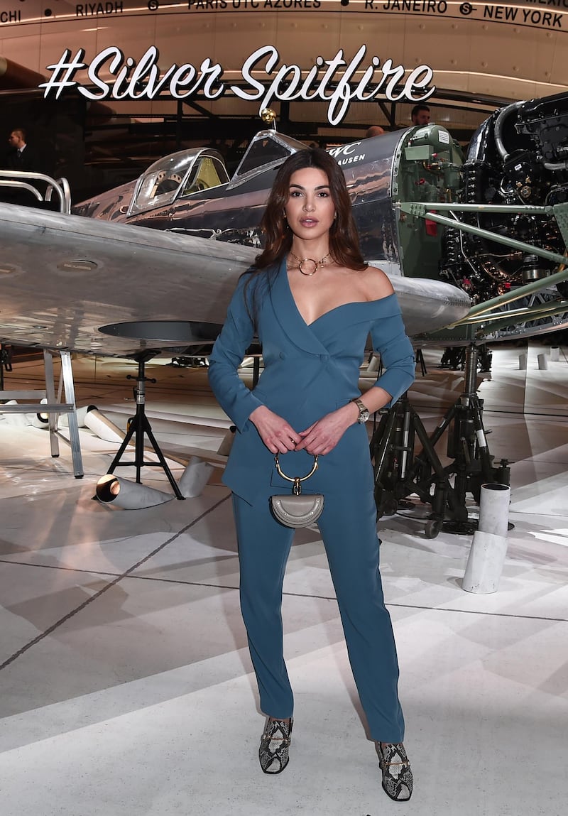 Fashion influencer Negin Mirsalehi opted for an off-the-shoulder dusk blue suit...