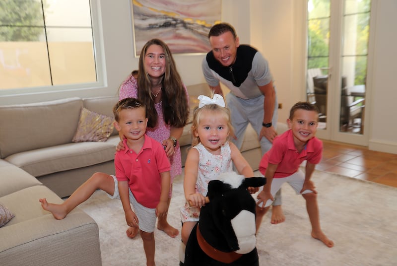 Brian Myers with his wife, Sacha, and their sons, Jack (right) and Bobby (left), and daughter, Molly, at their home in Jumeirah Golf Estates in Dubai. The family relocated to the emirate this year. Pawan Singh / The National