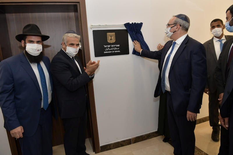 Israeli Foreign Minister Yair Lapid applauds as a plaque is unveiled during an inauguration ceremony of Israel's embassy in Abu Dhabi. Reuters