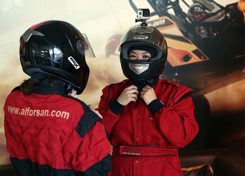 Abu Dhabi, 14, December, 2016 :  (L)  Juman Jarallah and  (R) Evelyn Lau  pose during the interview at the  Al Forsan International Sports Resort in Abu Dhabi. ( Satish Kumar / The National )
ID No: 99795
Section: News / Weekend
Reporter: Adam Workman *** Local Caption ***  SK-GoKarting-14122016-011.jpg