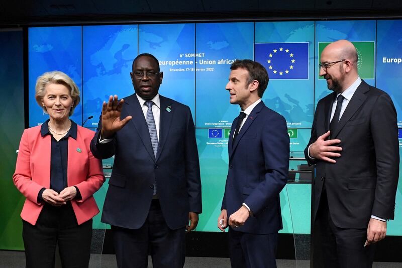 European Commission President Ursula von der Leyen, Senegal's President Macky Sall, France's President Emmanuel Macron and European Council President Charles Michel pose after the second day of the EU-AU summit. AFP