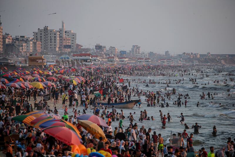 Palestinians spend time at the beach in Gaza City. EPA