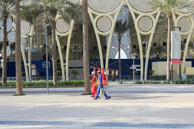 Workers at the Expo 2020 site ahead of the opening ceremony.  Reuters