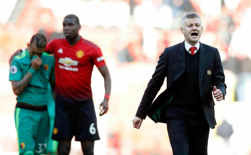 Manchester United manager Ole Gunnar Solskjaer, right, celebrates their victory after the final whistle during the English Premier League soccer match between Manchester United and Watford Town at Old Trafford Stadium, Manchester, England. Saturday, March. 30, 2019. (Martin Rickett/PA via AP)