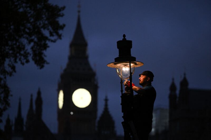 Paul Doy, an engineer, services a gas-powered lamp near the Houses of Parliament in central London. ‘I like the historical aspect of it,’ he said of his work, even if it means getting up at 5am to tend to the lamps in the fashionable district of Covent Garden. AFP