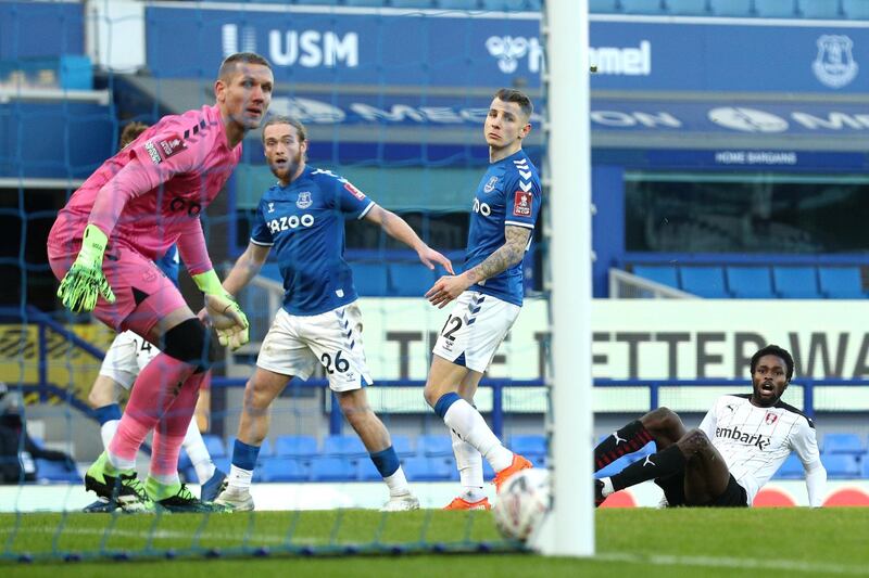 Rotherham's Matthew Olosunde, on ground, watches his shot hit the net to make the score 1-1. Getty