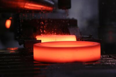 Hot forged bearing components move along a conveyor inside the Schaeffler AG factory in Schweinfurt, Germany, on Tuesday July 3, 2018. Schaeffler, the ball-bearings maker and automotive supplier, surged after lifting its revenue forecast for the industrial division and reporting higher-than-expected second-quarter profit. Photographer: Krisztian Bocsi/Bloomberg