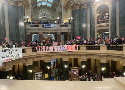 Abortion rights supporters display banners as they gather in the Wisconsin state Capitol in Madison on Sunday. AP