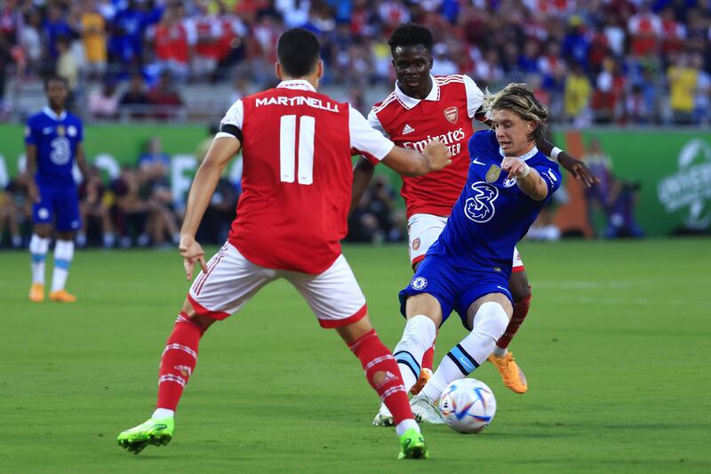 Chelsea midfielder Connor Gallagher on the ball while under pressure from Bukayo Saka and Gabriel Martinelli. Getty
