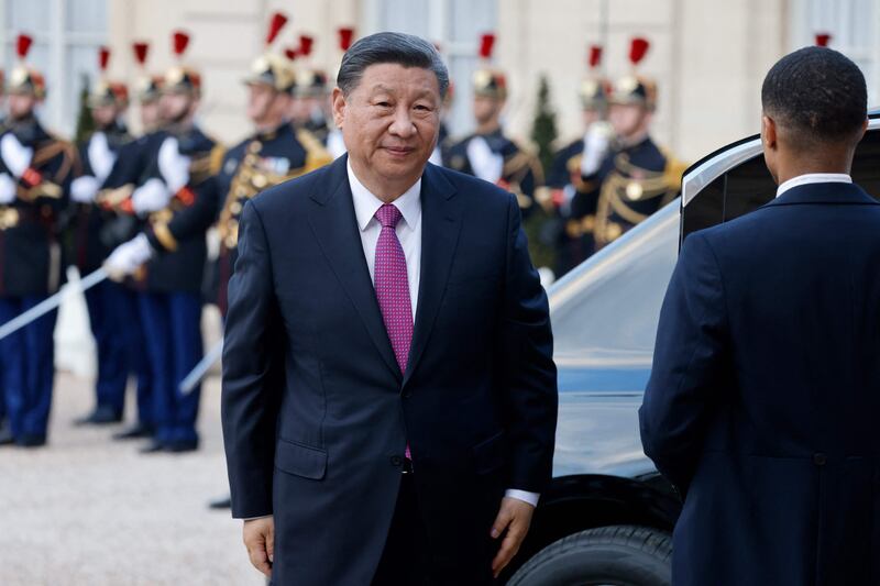 Mr Xi arrives for the dinner at the palace as part of his two-day state visit. AFP
