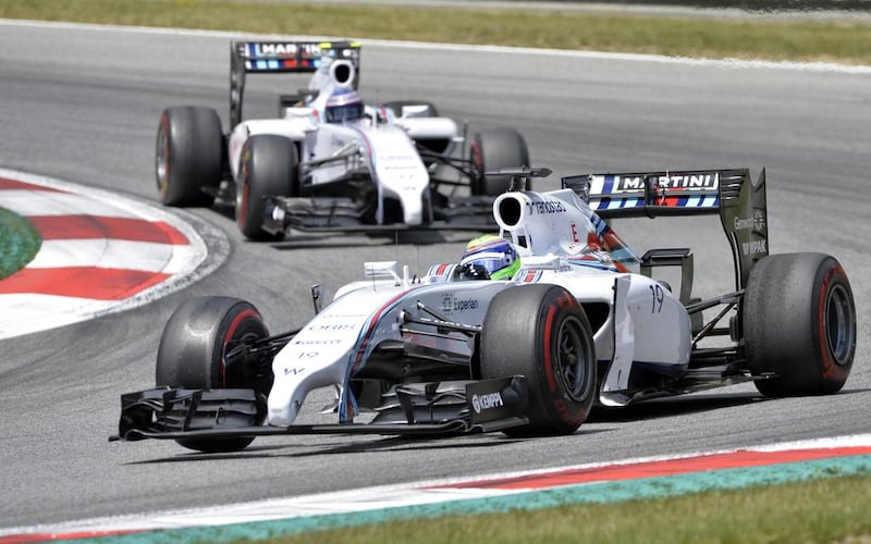Williams driver Felipe Massa (front) and teammate Valtteri Bottas compete in the Austrian Grand Prix at the Red Bull Ring in Spielberg on June 22, 2014. Samuel Kubani / AFP