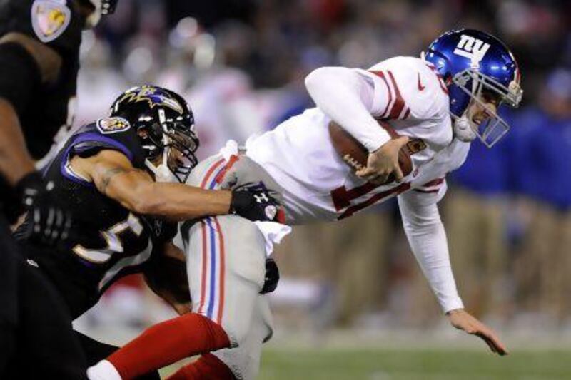 The Baltimore Ravens' defence made things tough on the New York Giants and quarterback Eli Manning, right.