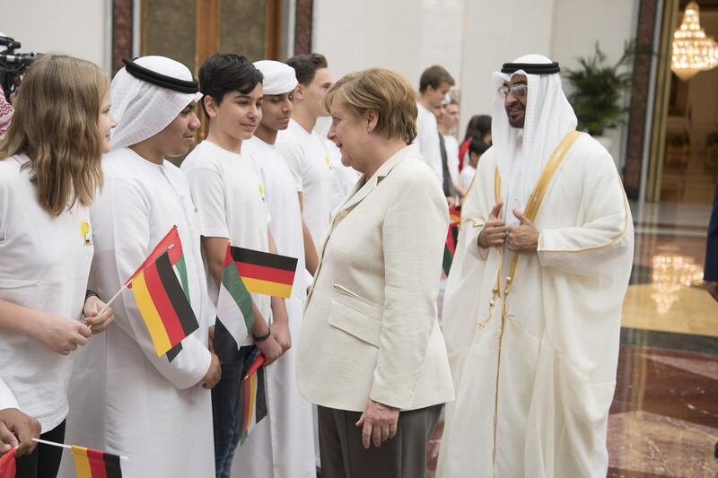 School children from the German School in Abu Dhabi also greeted Mrs Merkel on her arrival in the UAE capital. Ryan Carter / Crown Prince Court — Abu Dhabi