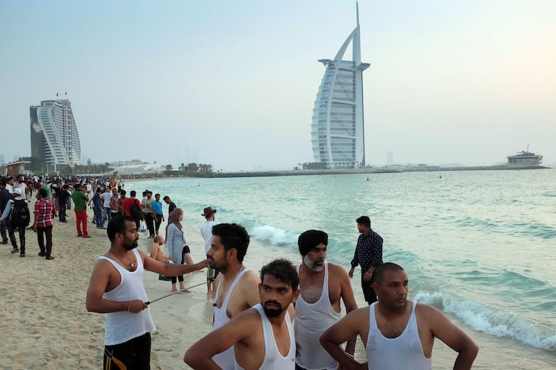 DUBAI, UNITED ARAB EMIRATES. 21 AUGUST 2018. Residents of Dubai enjoy the Eid break by visiting the sunset beach next to the Burj Al Arab. (Photo: Antonie Robertson/The National) Journalist: None. Section: National.