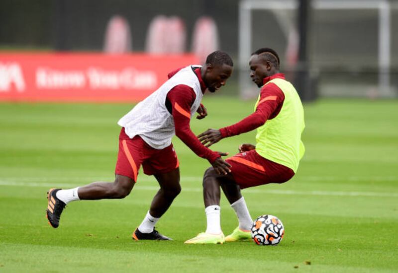 Sadio Mane and Naby Keita battle for the ball during training.