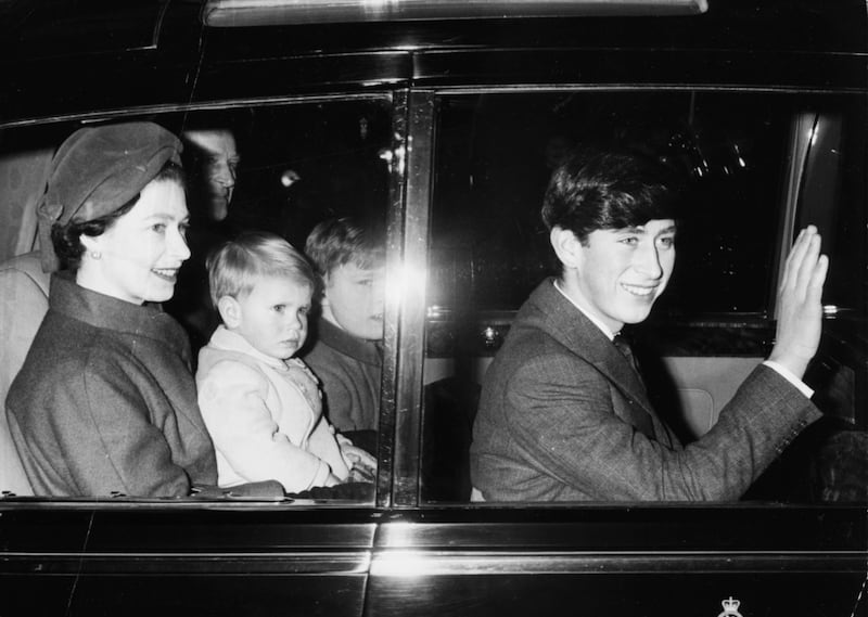 Queen Elizabeth and her family travel to Sandringham in 1966. Prince Andrew is on her lap, the Duke of Edinburgh to her left with Princess Anne on his lap, and Prince Charles, right