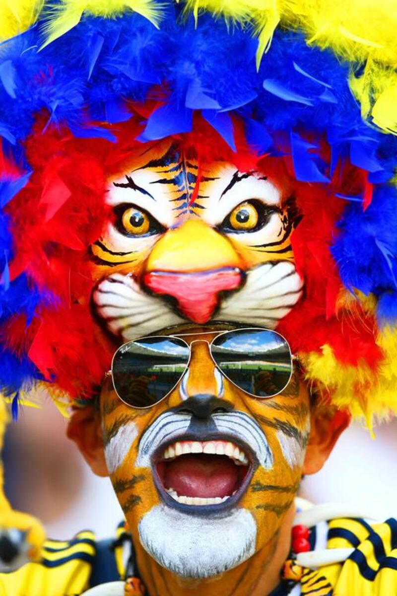 A Colombian fan shows support ahead of their World Cup opener. Paul Gilham / Getty Images