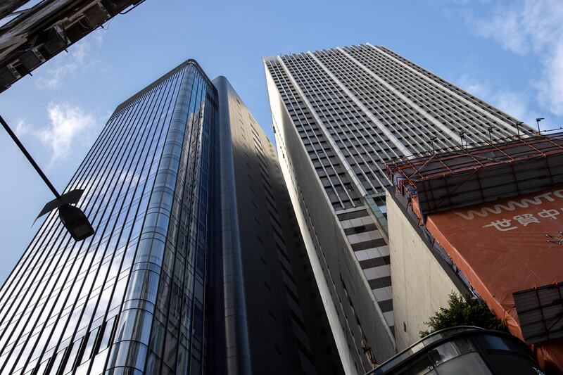 The World Trade Centre building, right, in Causeway Bay, Hong Kong.  About 1,200 people were removed from the building after an electrical fire that injured at least 13 and trapped hundreds on the roof. EPA