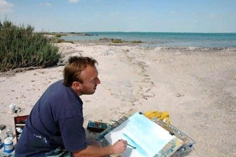 Andrew Field, an art and design teacher at British School Al Khubairat, painting at Saadiyat. Photo courtesy Andrew Field