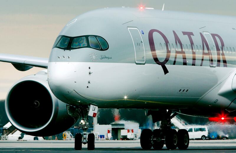 FILE- In this Jan. 15, 2015, file photo, a Qatar Airways jet arriving from Doha, Qatar, approaches the gate at the airport in Frankfurt, Germany. On Wednesday, Aug. 2, 2017, Qatar Airways said it is dropping an attempt to buy a big stake in American Airlines, an audacious bid that had received a chilly reception from American. (AP Photo/Michael Probst, File)